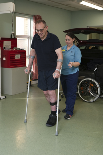 Standing with crutches