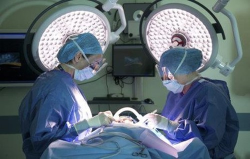 Two surgeons operating